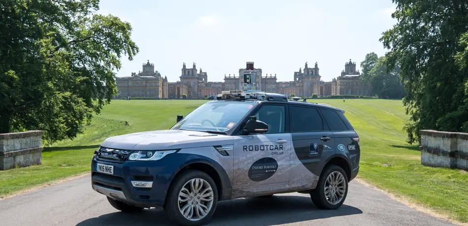 Oxford Robotics Institute vehicle on drive with Blenheim Palace in background