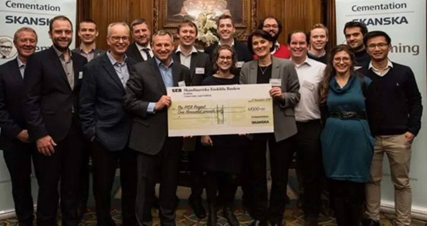 Professor Byron Byrne with members of the PISA Project team holding the winning cheque